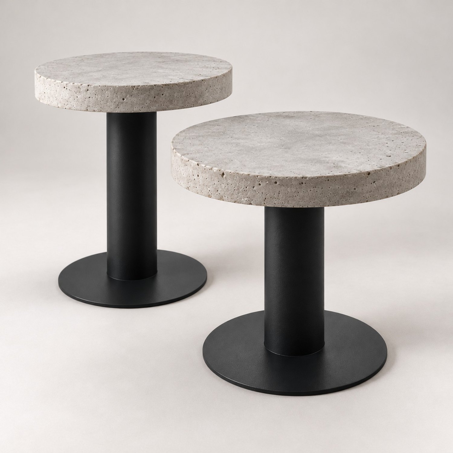 Two Brutal Twin concrete top tables with black metal bases